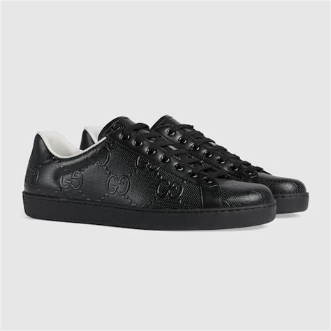 black gucci sneakers black print red x in the back|all black sneakers Gucci men.